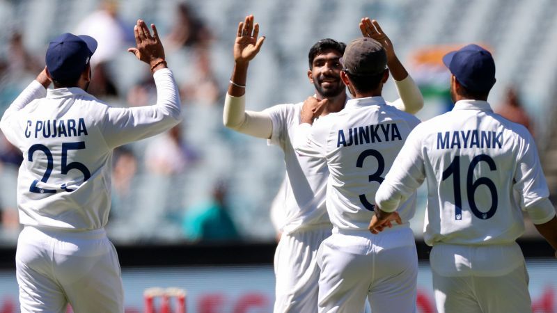 Jasprit Bumrah and Team India celebrate after picking up a wicket.