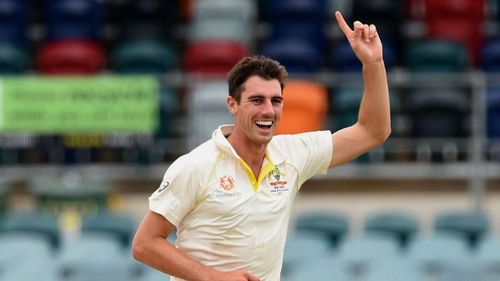 Pat Cummins celebrates after picking up a wicket.