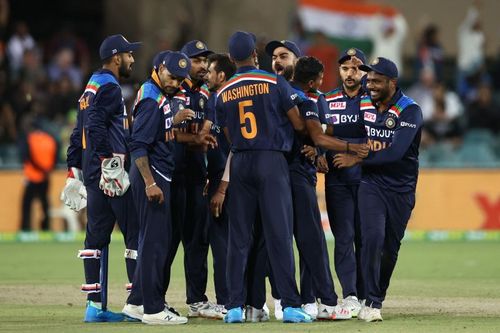 The Indian team celebrates after picking up a wicket.