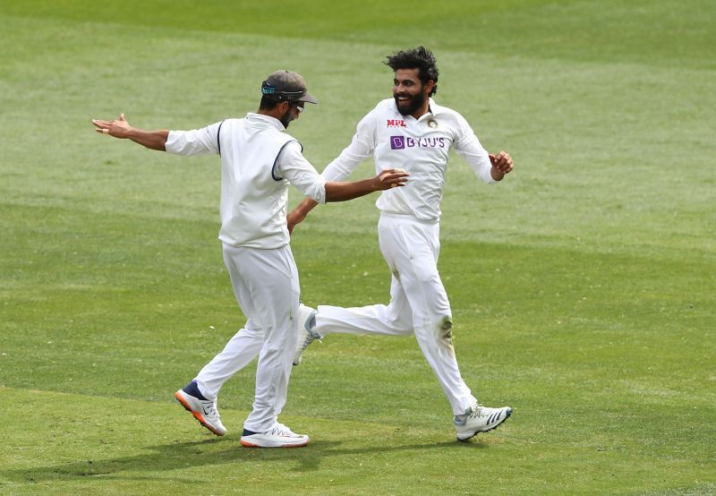 Ravindra Jadeja (R) celebrating with Ajinkya Rahane (L) after dismissing Matthew Wade