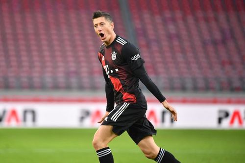 Robert Lewandowski rejoices after scoring a goal.