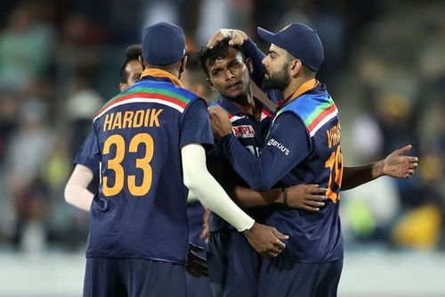 Virat Kohli and T Natarajan celebrating a wicket,