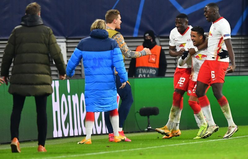 Kluivert celebrates with his teammates after scoring an important UCL goal to send them 3-0 up vs. Manchester United