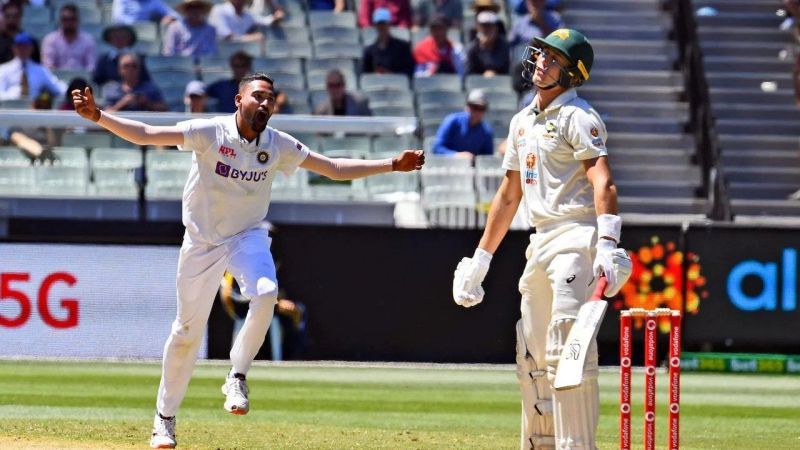 Debutant Mohammed Siraj celebrates after picking up the wicket of Marnus Labuschagne