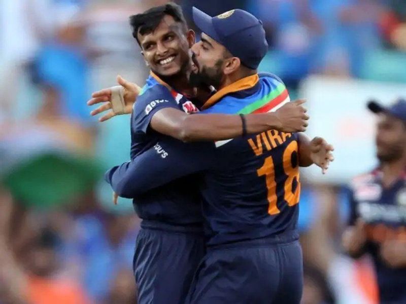 T Natarajan celebrates with Virat Kohli after picking up a wicket