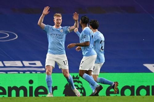 Kevin De Bruyne (left) celebrates after scoring off a rebound to put his side firmly in the lead.