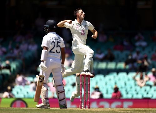 Pat Cummins celebrates after picking up the wicket of Cheteshwar Pujara.