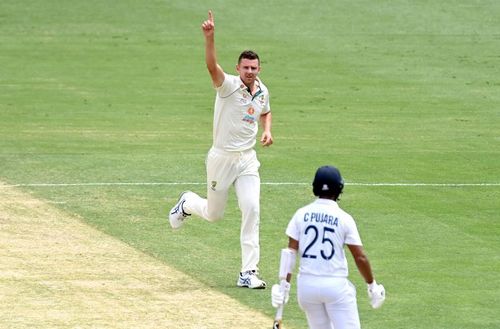 Josh Hazlewood (left) took five wickets in India's first innings of the ongoing Brisbane Test.