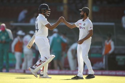 Hanuma Vihari (L) and Ajinkya Rahane shake hands after India's historic draw in Sydney