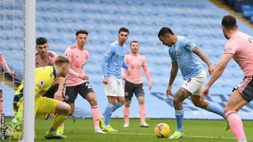 City's Gabriel Jesus (C) in action against the Blades