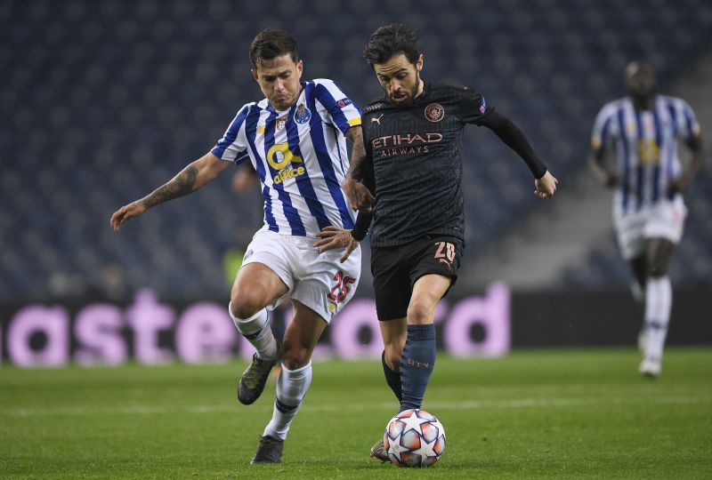 Otavio battles for possession with Bernardo Silva of Manchester City