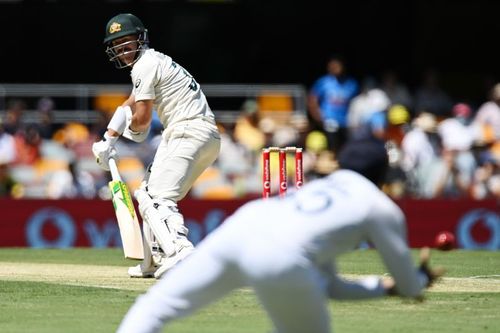 Rohit Sharma diving forward to take a catch of David Warner.