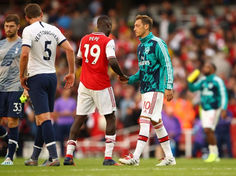 Arsenal&#039;s Nicolas Pepe (L) and Mesut Ozil