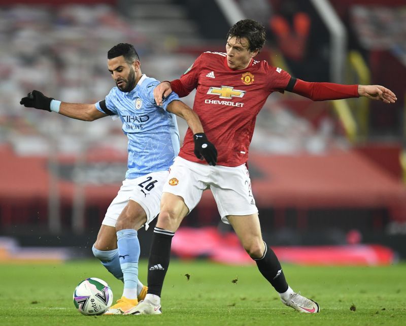 Riyad Mahrez (L) and Victor Lindelof during the Carabao Cup semifinal.