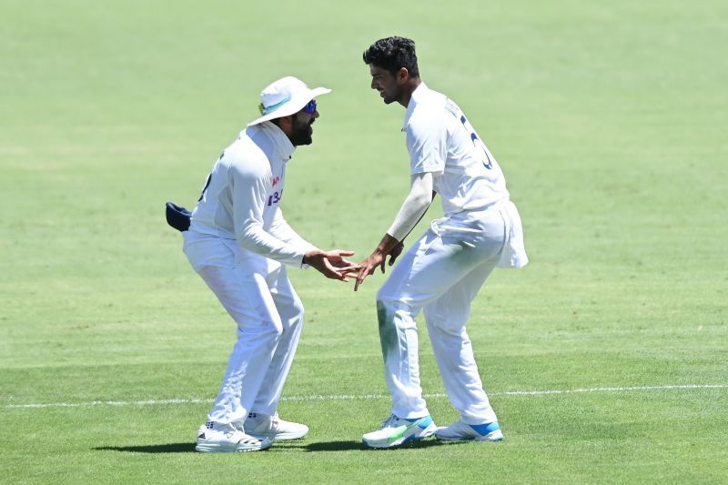Washington Sundar (R) dismissed Steve Smith to open his account with the ball in Test cricket
