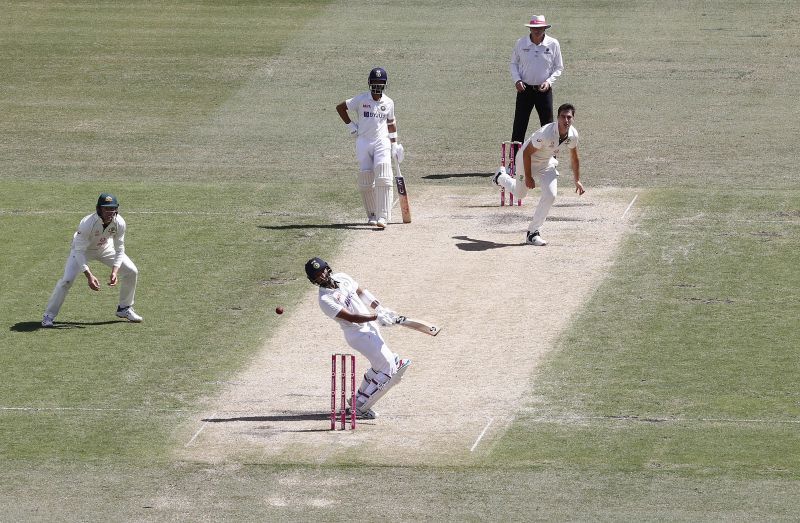 Cheteshwar Pujara swaying out of the way of a Pat Cummins bouncer