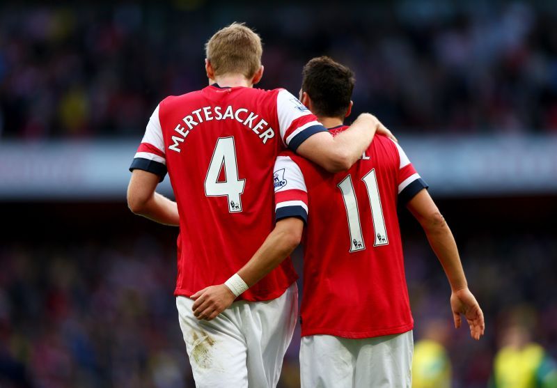 Per Mertesacker and Mesut Ozil