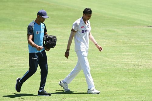 Navdeep Saini walks off with Team India's physio after complaining of groin pain.