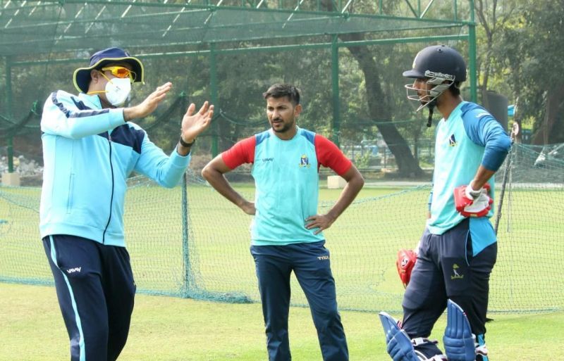 VVS Laxman (left) with Anustup Majumdar (center) during a nets session (Image Credits: CAB)