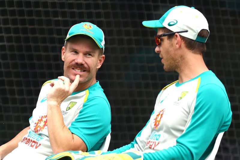 David Warner (L) chatting with skipper Tim Paine (R) during the latest nets session