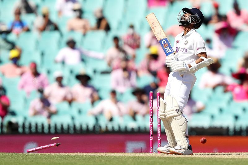 Ajinkya Rahane bottom-edged a Pat Cummins delivery onto his stumps.