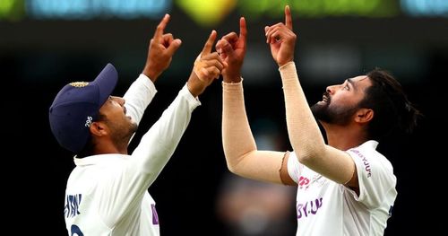 Mohammed Siraj celebrates with Mayank Agarwal after picking up his maiden five-wicket haul.