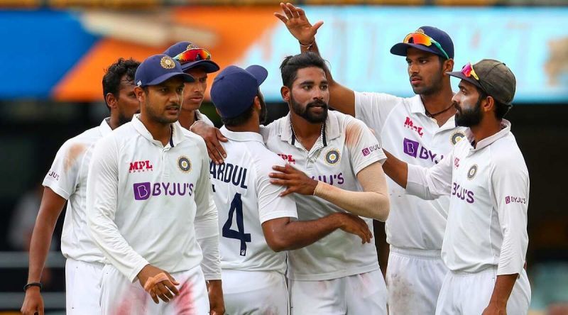 Mohammed Siraj celebrates with teammates after picking up his maiden five-wicket haul at the Gabba.