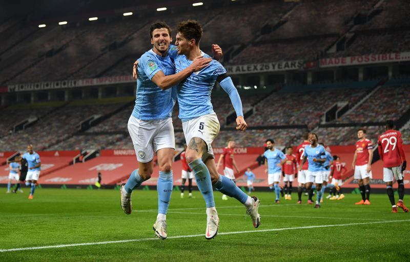 Ruben Dias (L) was every bit as impressive as his central defensive partner John Stones (R)