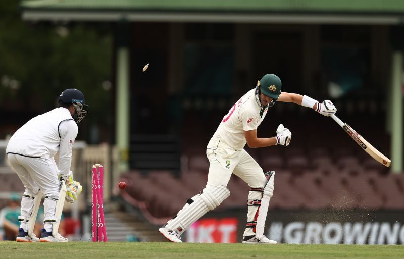 Bails fly as Pat Cummins is knocked out by Ravindra Jadeja's yorker.