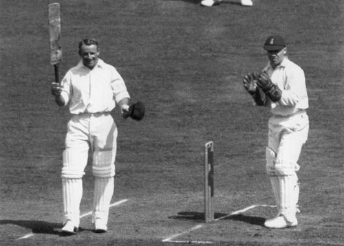 Don Bradman celebrates one of many milestones.