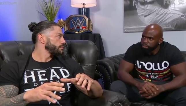 Roman Reigns and Apollo Crews.