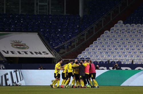 Borussia Dortmund players celebrate beating Schalke