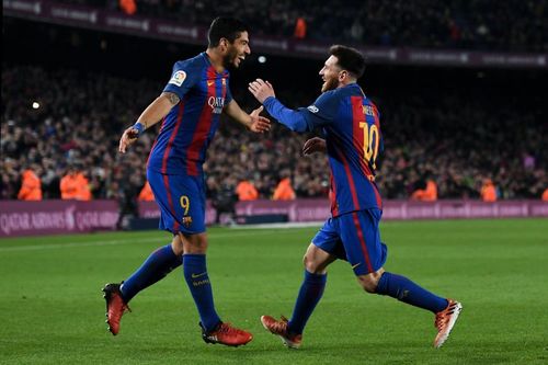 Luis Suarez and Lionel Messi<p>