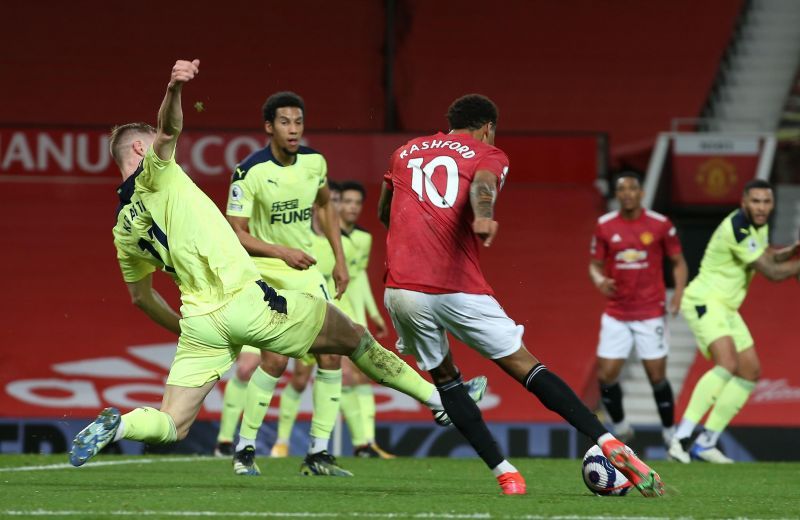 Marcus Rashford launches his goal past the Newcastle United defenders