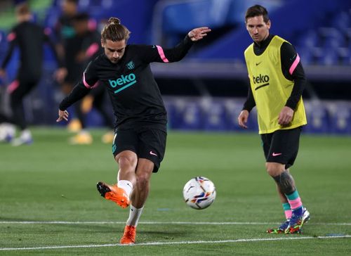 Barcelona superstars Antoine Griezmann (L) and Lionel Messi 