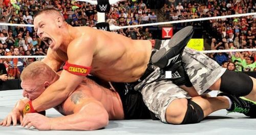 Brock Lesnar trying to fight out of John Cena's STF.