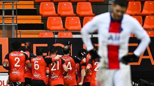 Lorient's players celebrate after scoring the winner in stoppage time of the second half.