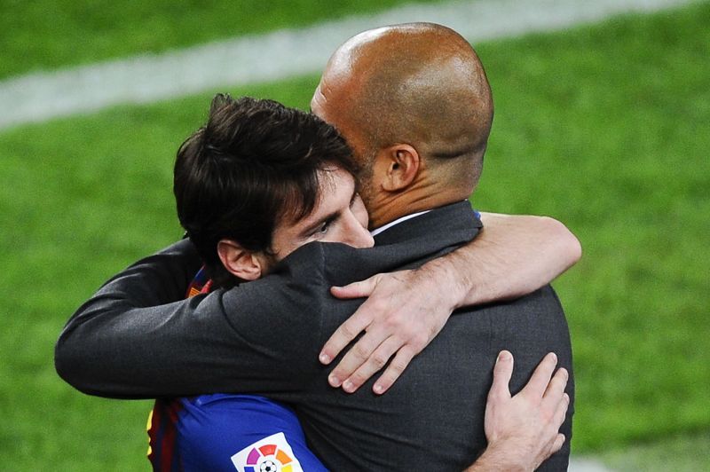 Lionel Messi (L) and Pep Guardiola