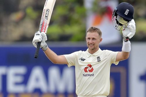 Joe Root celebrates a century.