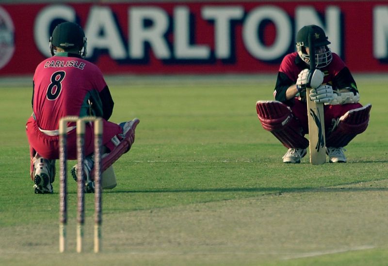 Stuart Carlisle and Grant Flower in the middle of their fighting knocks for Zimbabwe