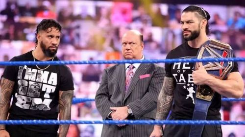 Jey Uso, Paul Heyman, and Roman Reigns.