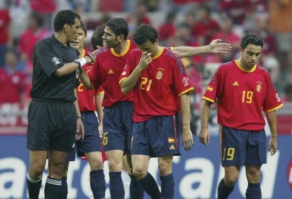 Spain protest one of several controversial refereeing decisions on the day