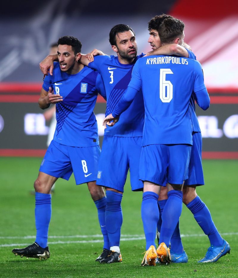 Greece players celebrate after equalizing against Spain