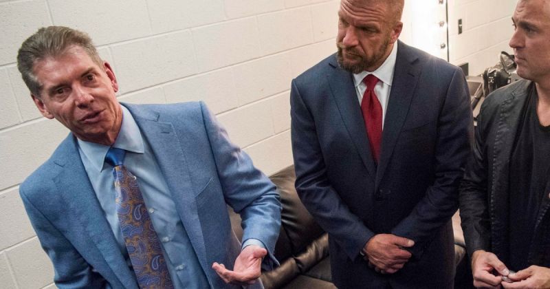 Vince McMahon, Shane McMahon, and Triple H.