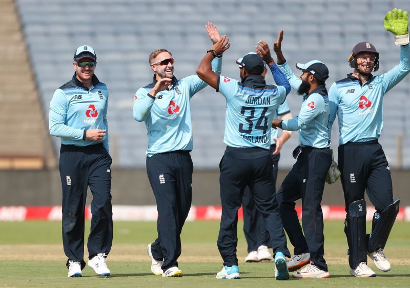 Team England celebrating a fall of wicket.