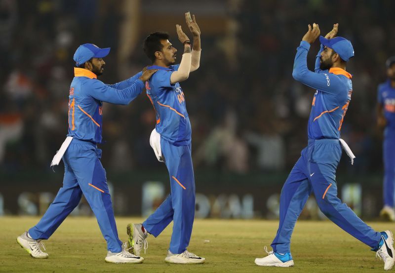 Yuzvendra Chahal celebrates with teammates.