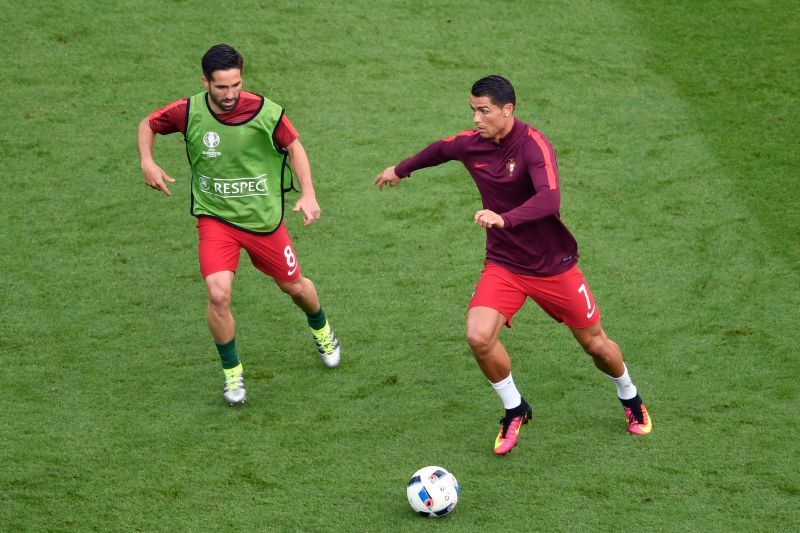 Joao Moutinho and Cristiano Ronaldo warming up