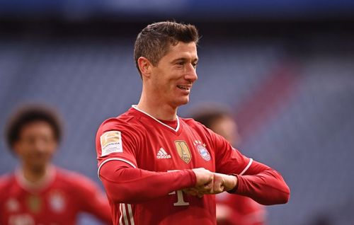 Robert Lewandowski celebrates after scoring a goal.