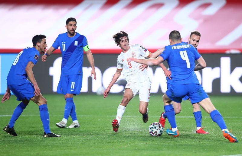 Greece players surround Bryan Gill