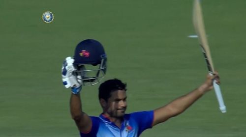 Aditya Tare celebrates his first List A hundred.